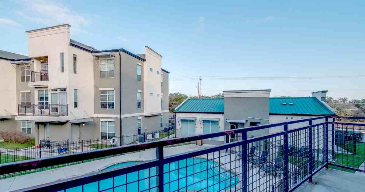 A balcony overlooking the sparkling pool.