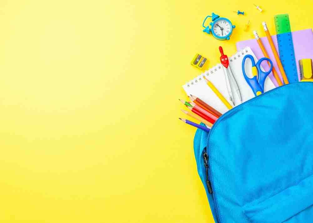 School supplies spilling out of a backpack.